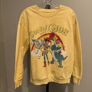 Disney Pixar Toy Story Sunnyside Day Care yellow sweatshirt size large